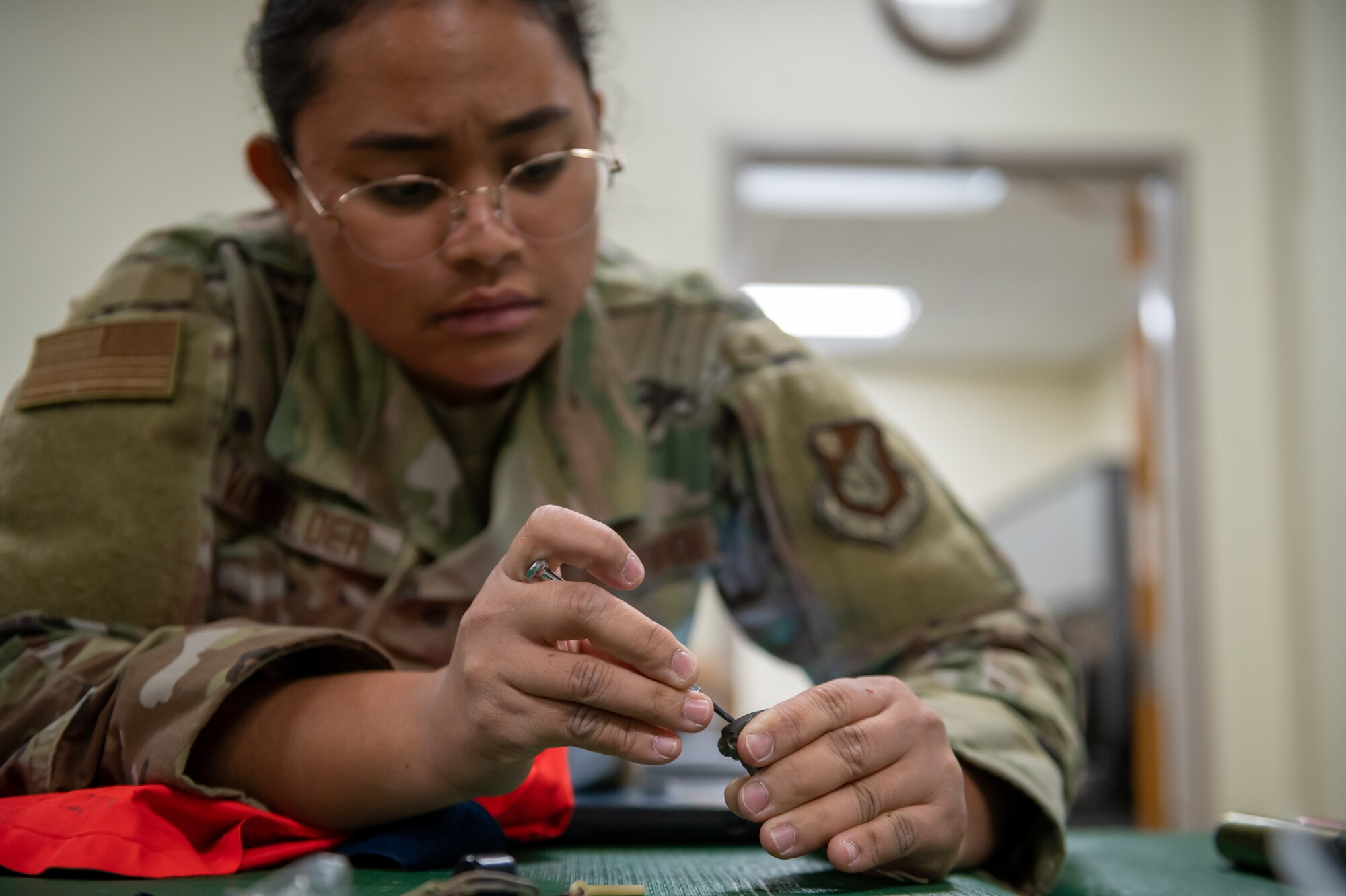 Airman inspecting aircrew equipment