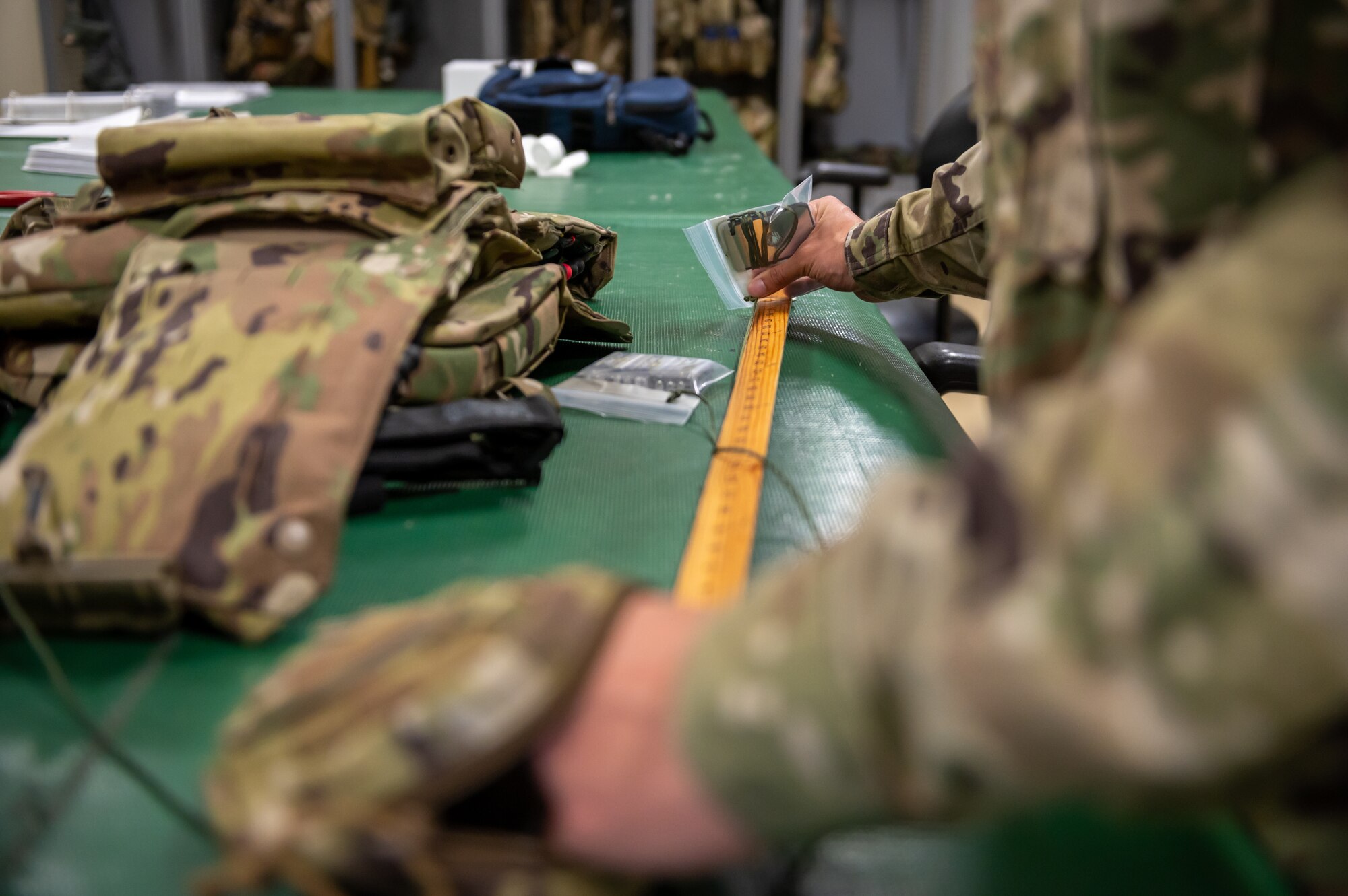 Airman inspecting aircrew equipment