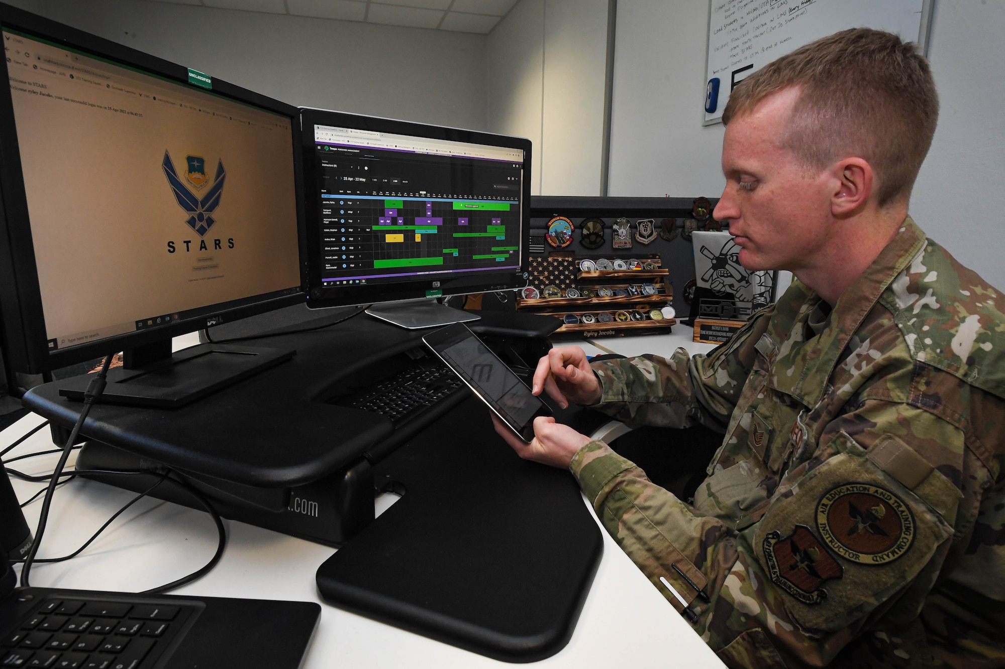 U.S. Air Force Tech. Sgt. Ryley S. Jacobs, 373rd Training Squadron, Detachment 20 instructor supervisor, schedules a course for a maintenance course class at Ramstein Air Base, Germany, April 25, 2022. Jacobs was recognized as Airlifter of the Week, April 21, 2022, for his many accomplishments. One of these accomplishments was transitioning his squadron from scheduling courses using a white board, to a more modern way that allowes them to have access to a calendar anytime, anywhere, on their phone or computer. (U.S. Air Force photo by Airman 1st Class Jared Lovett)