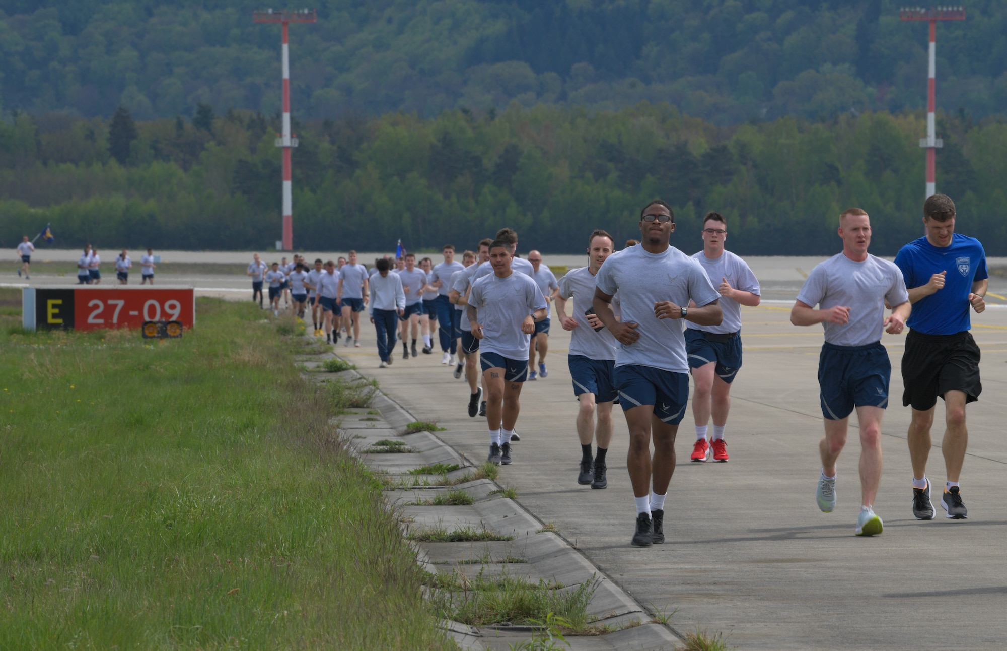 Airmen run on flightline