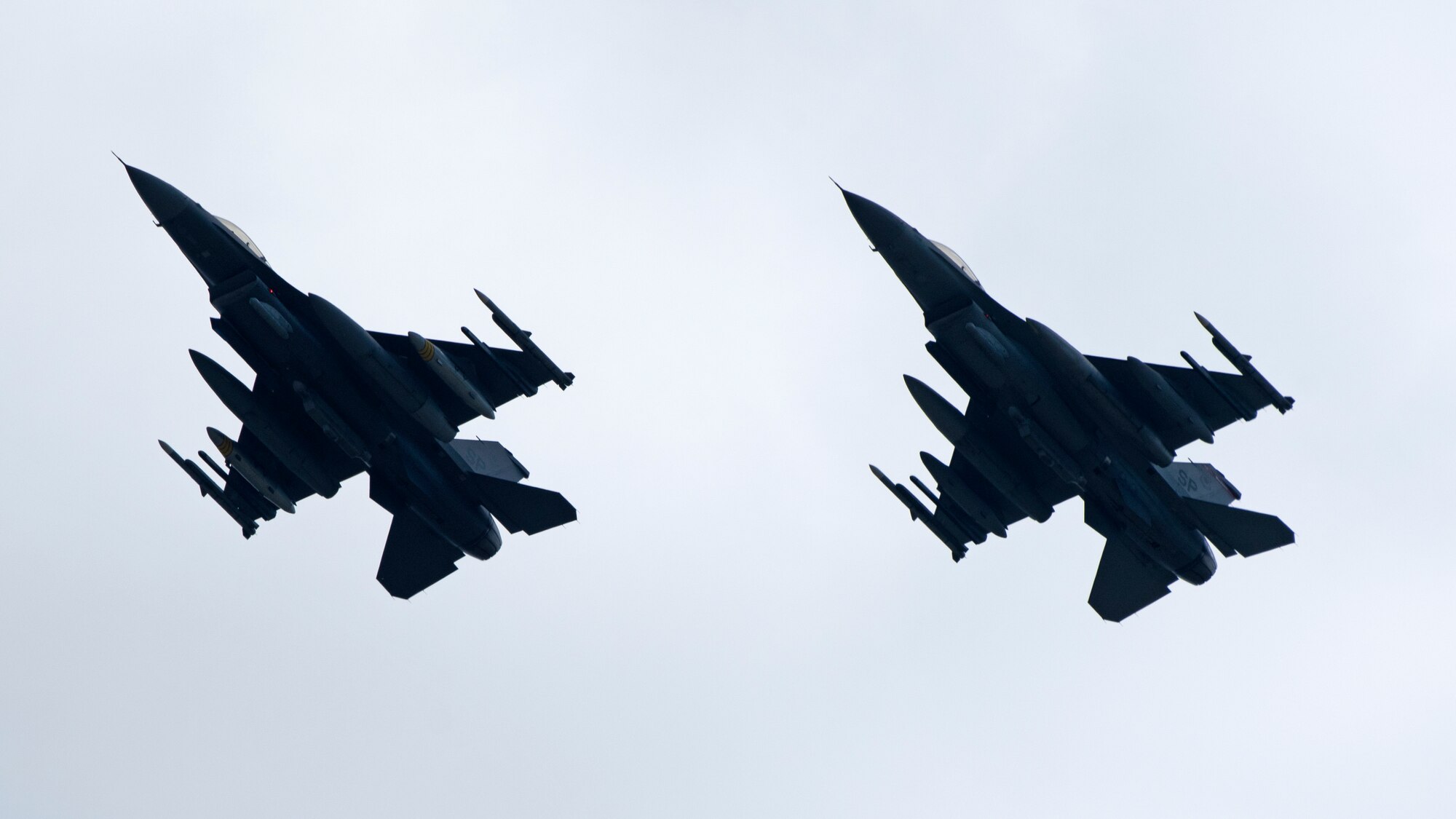 Two U.S. Air Force F-16 aircraft prepare to land.