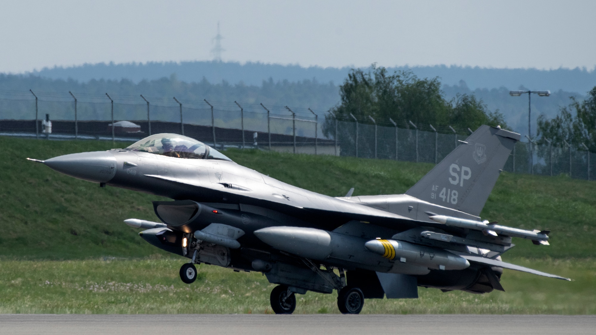 A U.S. Air Force F-16 aircraft lands at Spangdahlem Air Base, Germany, April 30, 2022.
