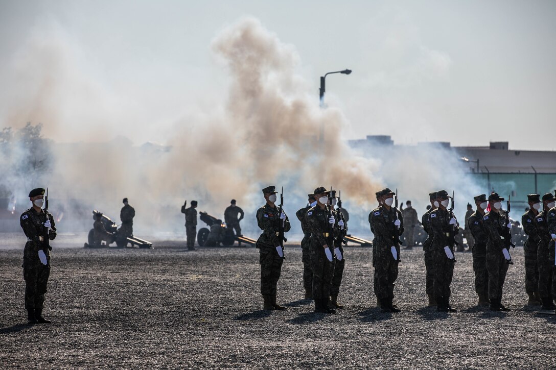 Soldiers with the United Nations Command Honor Guard stand at attention during a 19-gun salute in honor of Republic of Korea outgoing Defense Minister Suh Wook at Camp Humphreys, Republic of Korea, May 5, 2022. Gen. Paul J. LaCamera, Commander of United Nations Command, Combined Forces Command, and U.S. Forces Korea, expressed his gratitude for Minister Suh’s leadership that helped maintain a robust combined defense posture and ensured an ironclad alliance between the ROK and the U.S.