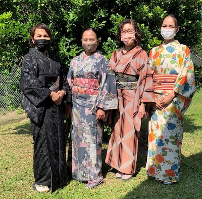 Christine Pamplona and the DLA Energy Okinawa Budget and Supply team wear traditional Japanese garments