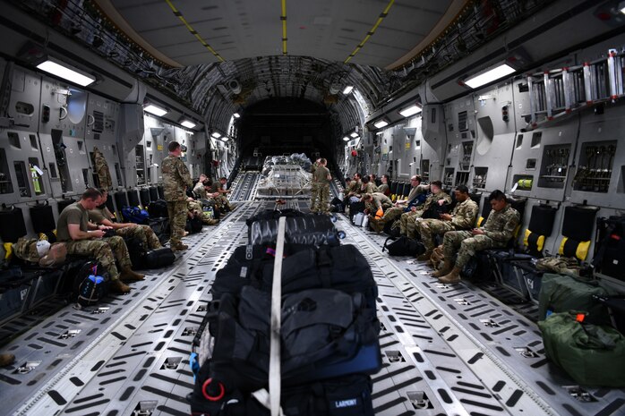 Airmen assigned to the 15th Airlift Squadron await deploying to the Middle East aboard a C-17 Globemaster III, at Joint Base Charleston, S.C., April 28, 2022.