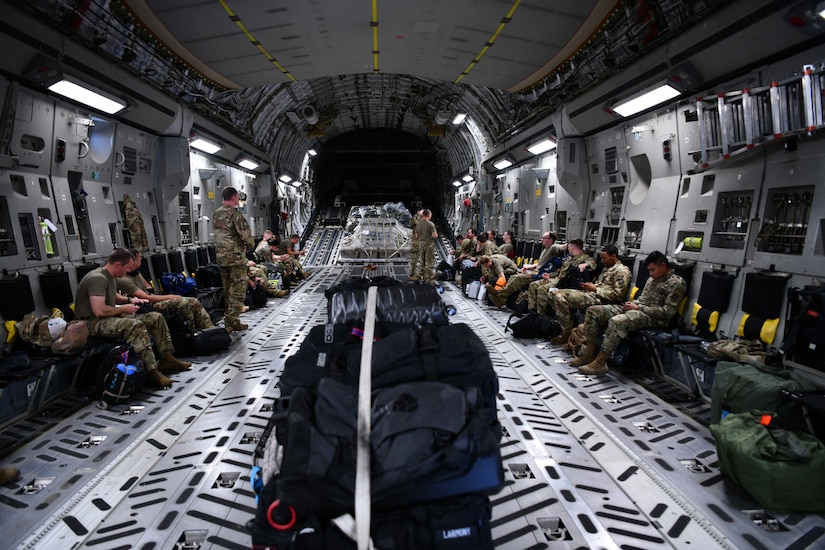 Airmen assigned to the 15th Airlift Squadron await deploying to the Middle East aboard a C-17 Globemaster III, at Joint Base Charleston, S.C., April 28, 2022.