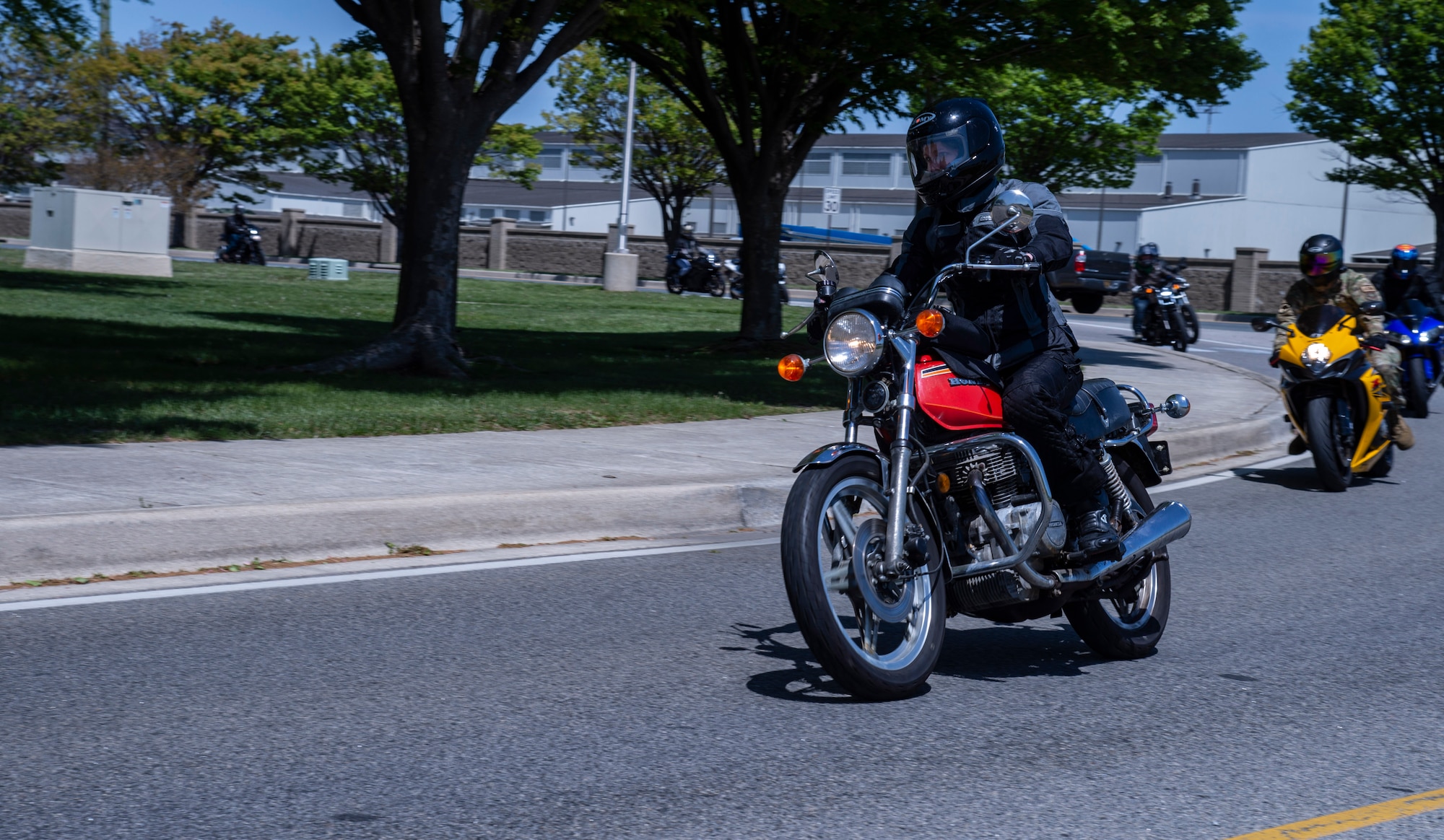 Airman 1st Class Elizabeth Burnette, 436th Civil Engineer Squadron emergency management apprentice, rides her motorcycle towards the main gate during the 2022 Motorcycle Safety Day mentorship ride on Dover Air Force Base, Delaware, April 29, 2022. Organized by the 436th Airlift Wing Safety Office, “The Message of Mentorship” was this year’s theme as riders listened to numerous guest speakers, received refresher training, observed motorcycle demonstrations and participated in a planned ride throughout central Delaware. (U.S. Air Force photo by Roland Balik)