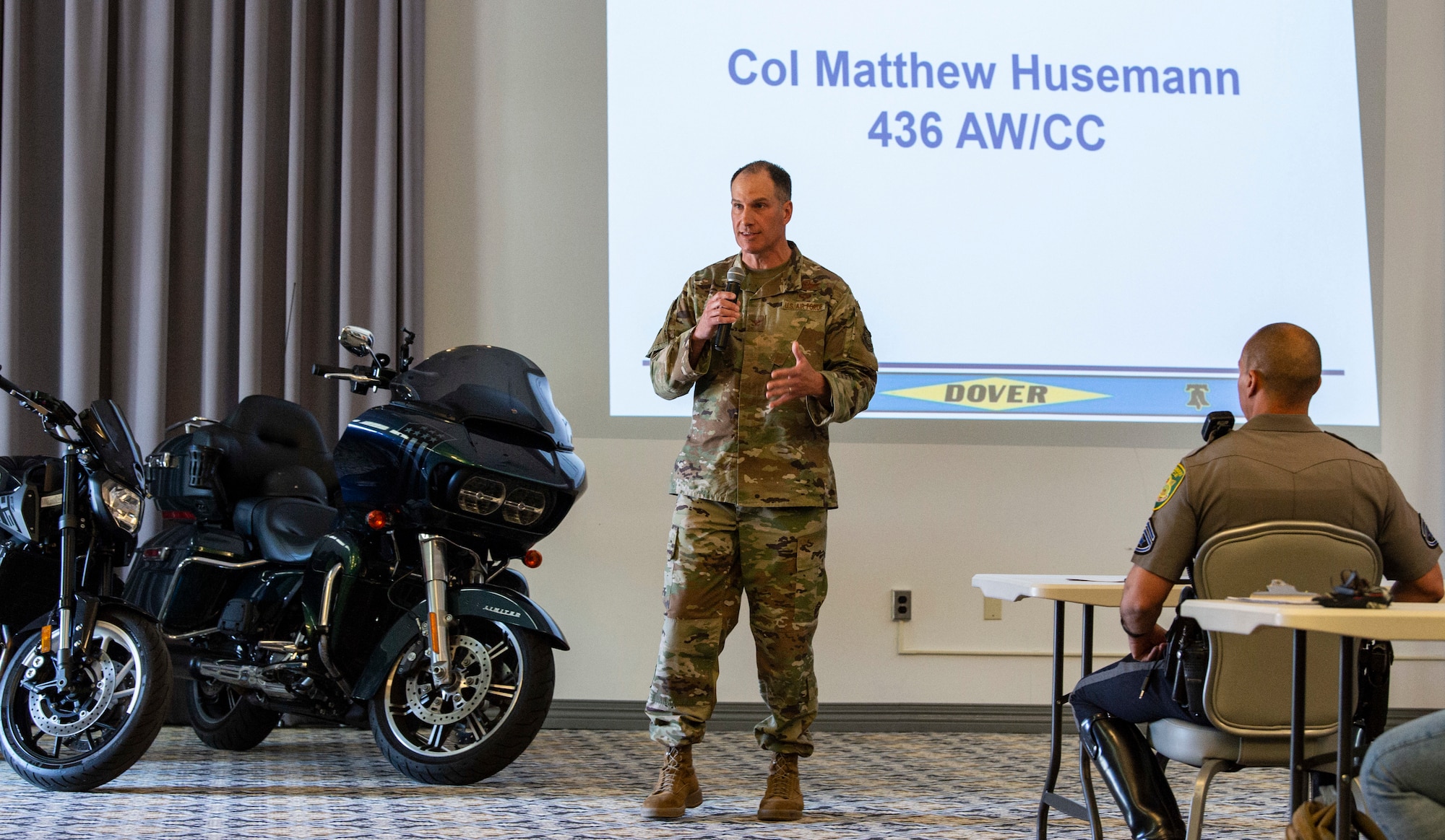 Col. Matt Husemann, 436th Airlift Wing commander, makes opening remarks during the 2022 Motorcycle Safety Day briefing held at The Landings on Dover Air Force Base, Delaware, April 29, 2022. Organized by the 436th AW Safety Office, “The Message of Mentorship” was this year’s theme as riders listened to numerous guest speakers, received refresher training, observed motorcycle demonstrations and participated in a planned ride throughout central Delaware. (U.S. Air Force photo by Roland Balik)