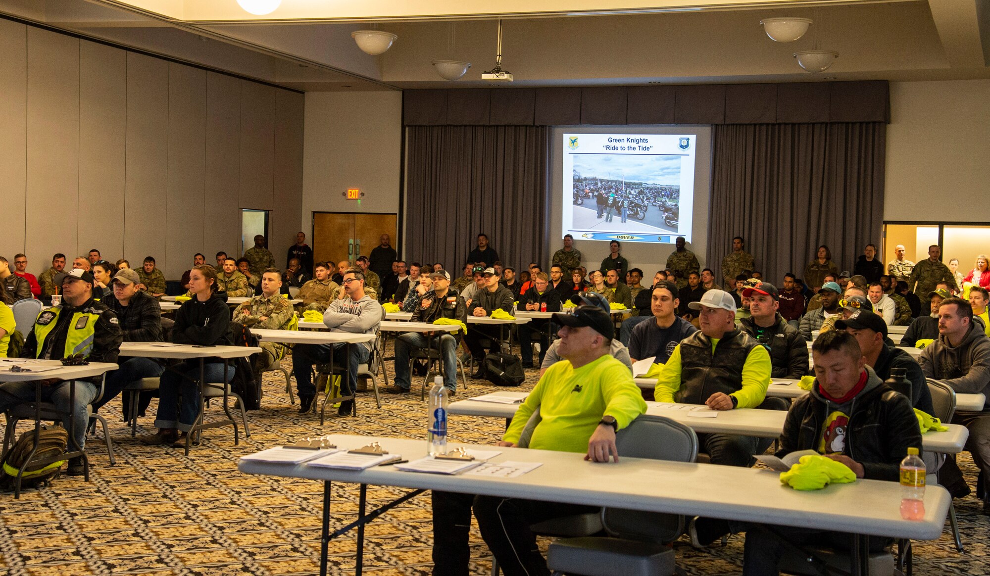 Motorcycle riders listen to guest speakers during the 2022 Motorcycle Safety Day briefing held at The Landings on Dover Air Force Base, Delaware, April 29, 2022. Organized by the 436th Airlift Wing Safety Office, “The Message of Mentorship” was this year’s theme as riders listened to numerous guest speakers, received refresher training, observed motorcycle demonstrations and participated in planned ride throughout central Delaware. (U.S. Air Force photo by Roland Balik)
