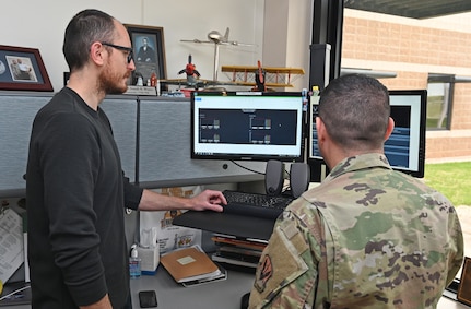 U.S. Air Force Lt. Col. Joseph Winter, 175th Force Support Squadron commander and field grade officer adviser, speaks with Joe Grigg, CyberWinter Studios founder, about the best practices for the CyberWinter Studios program the 175th Wing will be using in the future. The CyberWinter Studios is the first funded program from the 175th Spark Cell.