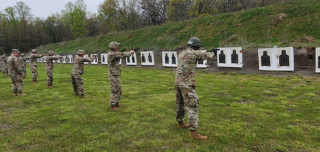 Service members display their marksmanship skills during the German Armed Forces Proficiency Badge test event at Fort Indiantown Gap, Pa. on May 2, 2022. The test, ran by the 94th Training Division, 80th Training Command's Regional Training Site-Maintenance here, lasted three days and included a pistol competition, a 12-kilometer ruck march, and fitness and swimming events.