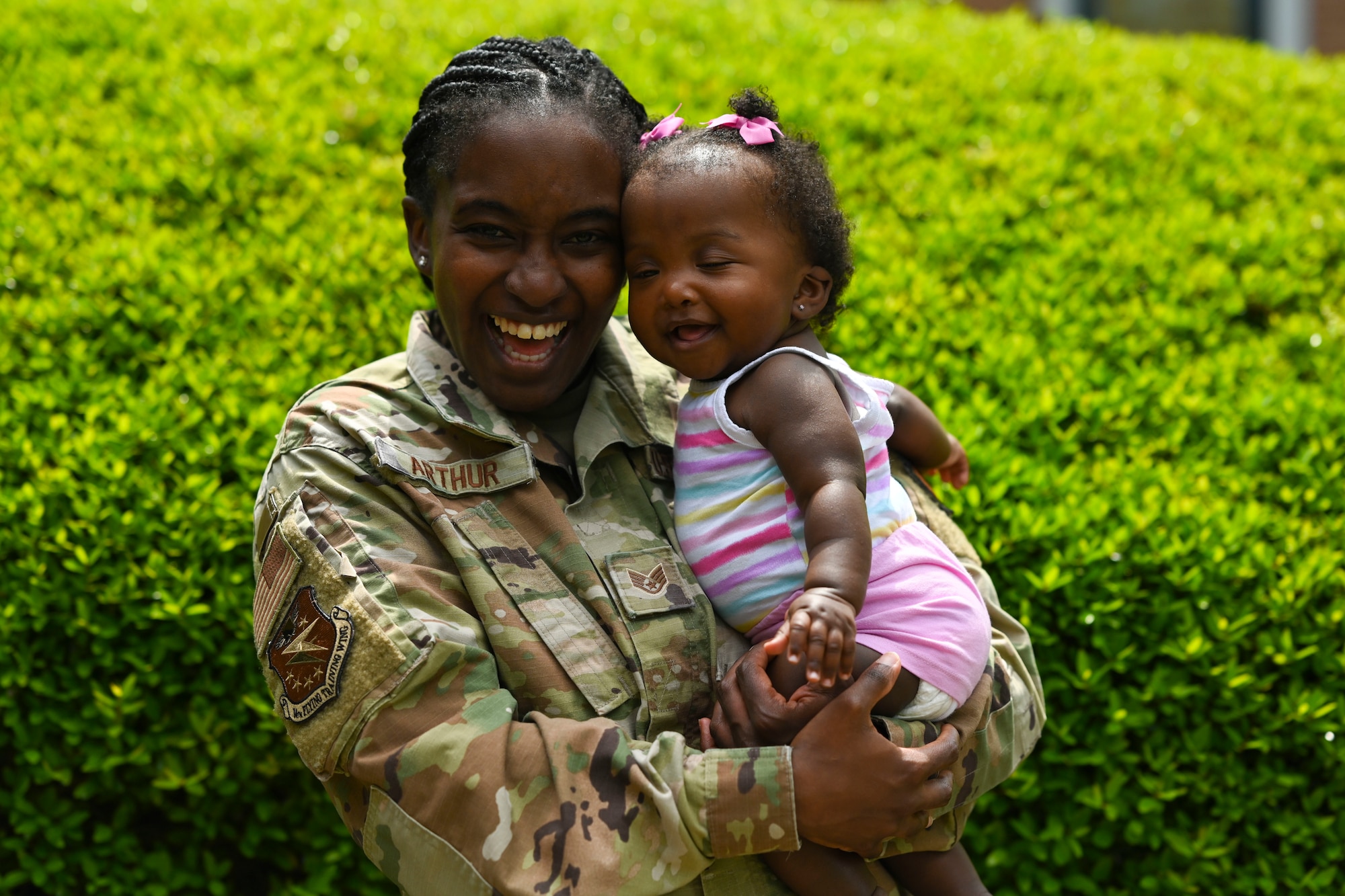 Staff Sgt. Cierra Arthur, 14th Flying Training Wing religious affairs airman, poses with her daughter for a Mother’s Day portrait, May 4, 2022, on Columbus Air Force, Miss. In 1914, Congress made the second Sunday in May Mother’s Day! (U.S. Air Force photo by Airman 1st Class Jessica Haynie)