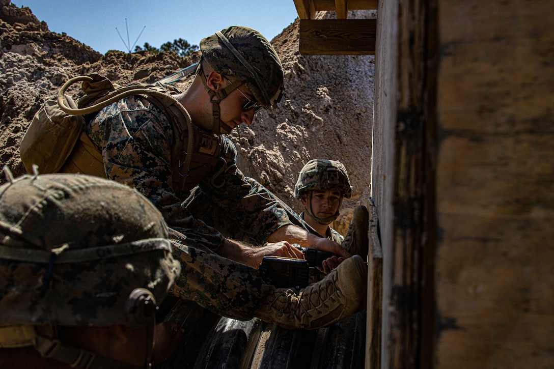 U.S. Marine Corps Cpl. Luke Beverland, a combat engineer with Engineer Support Company, 8th Engineer Support Battalion, attaches a pipe to an underground bunker during a field exercise at Camp Lejeune, N.C., April 26, 2022. Engineer Support Company conducted a field exercise in order to increase readiness while providing tactical utilities and heavy equipment support in an urban terrain environment.