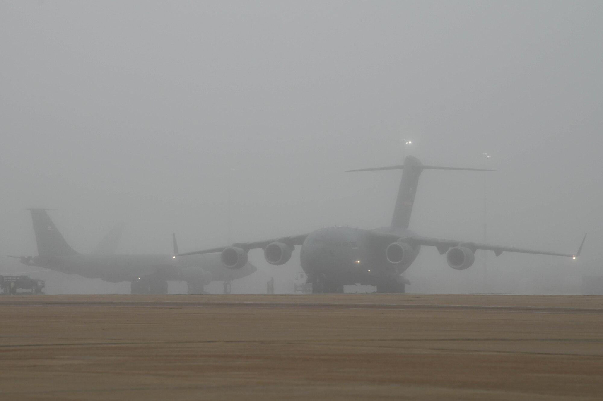 A C-17 Globemaster III taxis on the flight line due to incoming severe weather at Altus Air Force Base, Oklahoma, May 4, 2022. U.S. Air Force Col. Blaine Baker, 97th Air Mobility Wing commander, identified three priorities for the severe weather flyaway: preserve safety, preserve property and recover the mission. (U.S. Air Force photo by Airman 1st Class Trenton Jancze)