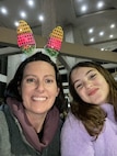 Mom and daughter smile for a selfie