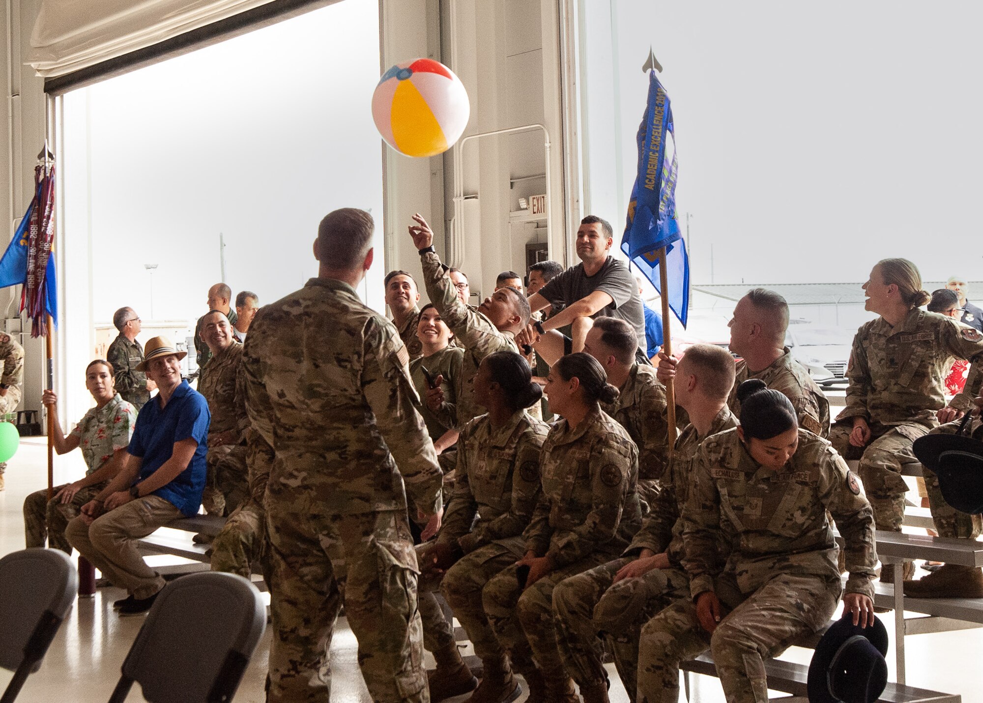 Attendees enjoy a beach ball at awards ceremony