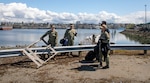 Sailors from the Chief Petty Officer Association pick up trash in honor of Earth Day at Naval Station Everett in Everett, Washington April 22, 2022. The Navy is committed to strong environmental stewardship and is a U.S. government leader in sustainable energy programs. (U.S. Navy photo by Mass Communication Specialist 2nd Class Ethan Soto)