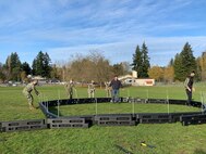 BREMERTON, Wash. (Nov. 17, 2021) Sailors assigned to the to the Ohio-class nuclear-powered guided missile submarine USS Michigan (SSGN 727) build playground equipment at West Hills STEM Academy. Their volunteer efforts were part of the "Partnerships in Education" program, where Navy commands partner with local schools to connect with their community while earning volunteer hours. (U.S. Navy photo by Rebecca McLenithan/Released)
