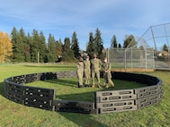 BREMERTON, Wash. (Nov. 17, 2021) Sailors assigned to the to the Ohio-class nuclear-powered guided missile submarine USS Michigan (SSGN 727) pose for a photo around playground equipment they helped build at West Hills STEM Academy. Their volunteer efforts were part of the "Partnerships in Education" program, where Navy commands partner with local schools to connect with their community while earning volunteer hours. (U.S. Navy photo by Rebecca McLenithan/Released)