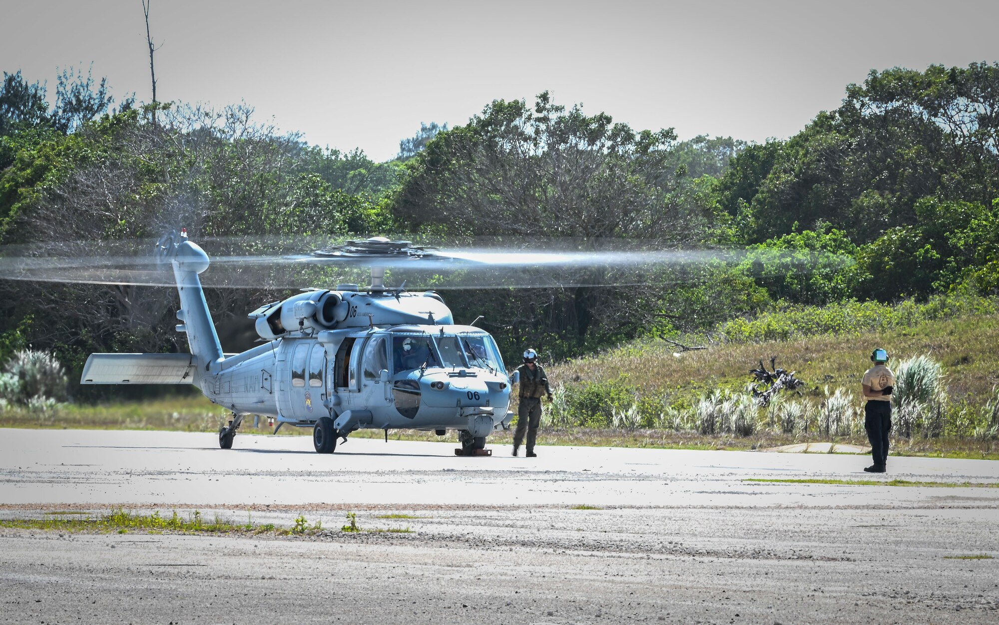 U.S. Navy personnel assigned to the Helicopter Sea Combat Squadron 25, prepares a MH-60S Knighthawk for take off on Northwest Field during a joint field training exercise at Andersen Air Force Base, Guam, April 29, 2022.