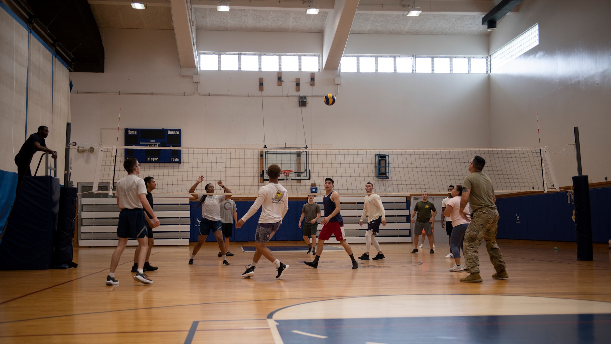 Airmen from the 18th Wing play volleyball during the first annual Dorm Olympics at Kadena Air Base, Japan, April 29, 2022. Each participant earned points for the dorm they represented in each event, and all points were tallied at the end of the week to determine the winning dorm. (U.S. Air Force photo by Senior Airman Jessi Monte)