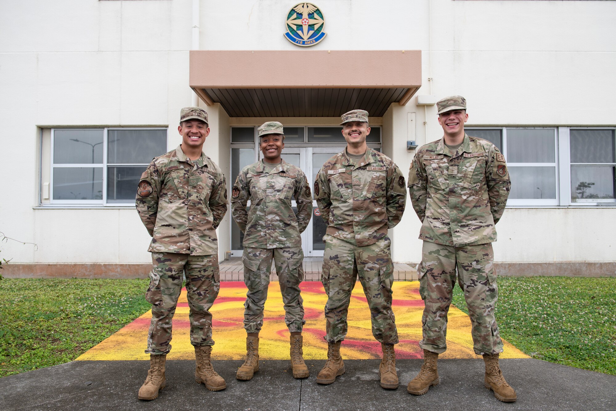 Airman 1st Class Jaylin Velazquez, 718th Aircraft Maintenance Squadron aerospace propulsion journeyman, left, poses with his fellow council members in front of dorm 179 at Kadena Air Base, Japan, May 5, 2022. From Velazquez’s right are A1C Myasia Riddick, 18th AMXS weapons load crew member, A1C Gregory Polk, 718th AMXS electronic warfare specialist and A1C Eric Melao, 718th AMXS electrical and engineering specialist. (U.S. Air Force photo by Senior Airman Jessi Monte)