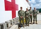 (Left to Right) Religious Program Specialist 2nd Class Evan Andrade, Lt. Jg. Wendy Byh-Jongejan, RP2 Daniel Tomaso, and Cmdr. Christopher Martin pose in front of the Military Sealift Command hospital ship USNS Mercy (T-AH 19) prior to a Pacific Partnership 2022 deployment at Naval Base San Diego, April 12. The Sailors make up the USNS Mercy’s religious staff. Mercy can steam to assist anywhere to provide relief as a symbol of Navy Medicine’s abilities around the world, and must be in a five-day-activation status in order to support missions over the horizon, and be ready, reliable and resilient to support mission commanders.(U.S. Navy photo by Mass Communication Specialist Seaman Raphael McCorey)