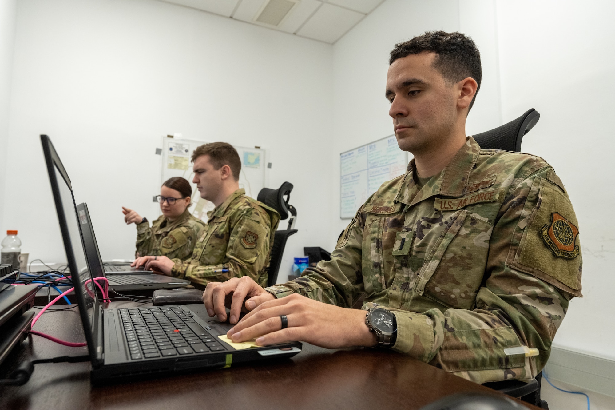 First Lt. James McInvaille, 22nd Communications Squadron Mission Defense Team operator, and other members of the Mission Defense Team utilize Endgame to execute a strike mission March 25, 2022, at Morón Air Base, Spain. Endgame is software that allows Cyber Airmen to detect, eploit and mitigate cyber threats. (U.S. Air Force photo by Staff Sgt. Nathan Eckert)