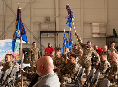 attendees stand and cheer at ceremony