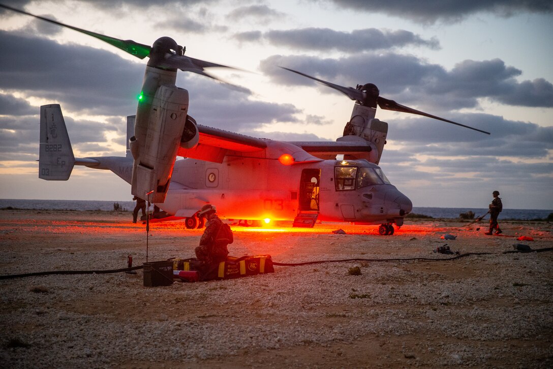 A U.S. Marine Corps MV-22B Osprey with Marine Medium Tiltrotor Squadron 265 (Rein.), 31st Marine Expeditionary Unit (MEU), pumps fuel to a Forward Arming and Refueling Point (FARP), on Ie Shima, Jan. 31, 2022. A FARP is used to extend the capabilities of rotary or fixed wing aircrafts to allow rearming and refueling without having to fall back to a forward operating base. The 31st MEU is operating aboard ships of America Expeditionary Ready Group in the 7th fleet area of operations to enhance interoperability with allies and partners and serve as a ready response force to defend peace and stability in the Indo-Pacific region. (U.S. Marine Corps photo by Lance Cpl. Malik Lewis)