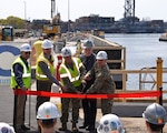 KITTERY, ME. April 27, 2022, Portsmouth Naval Shipyard:  The shipyard held a ribbon cutting ceremony for the completion of the Dry Dock #1 Super Flood Basin.  The super flood basin is a key project within the Navy's Shipyard Infrastructure Optimization Program.   Pictured (l to r): Mr. Peter Vigue, Chair of Cianbro Company; Mr. David Bernier, Sr. Vice President, Stantec, Inc.; Capt. Frank Carroll, Officer in Charge of Construction; Mr. Steve Fahey, Shipyard Nuclear Engineering Program Department Head;  and Capt. Brian McLain, Acting Shipyard Commander.  (U.S. Navy photo by Selena Brock/Released)