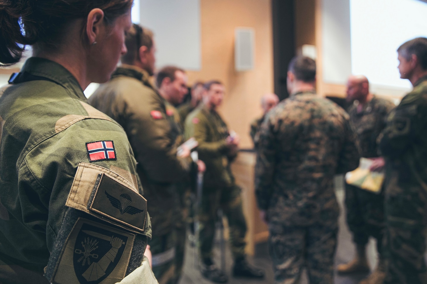 Service members with the U.S. Marine Corps, assigned to the 22nd Marine Expeditionary Unit, and the Norwegian Army attend a planning conference during a bilateral training event in Setermoen, Norway, April 22, 2022.