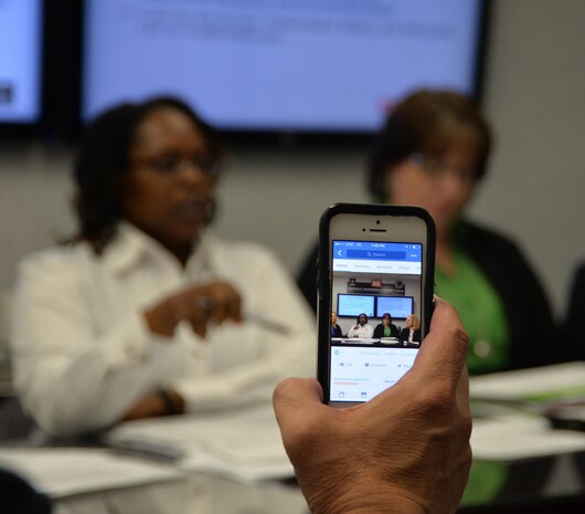 A smart phone is used during a Huntsville Center industry briefing to ensure geographically removed small business representative can attend the event. Huntsville Center’s Office of Small Business Programs was recognized April 27 by the Army as the top Small Disadvantaged 8(a) Business Program for 2021. One of the high points of the program's selection was building on virtual capabilities by conducting virtual industry briefs.