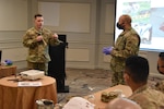 Staff Sgt. William Rudd, 1175th Military Police Co., facilitates a presentation on taking DNA evidence with Staff Sgt. Jaymes Dooley (1139th MP Co.), serving as a demonstrator. The presentation was part of a crime scene investigation subject matter expert exchange between Missouri National Guard Soldiers and members of Panama's law enforcement and protection agencies. The Missouri National Guard has partnered with the country of Panama since 1996 under the Department of Defense National Guard Bureau State Partnership Program.