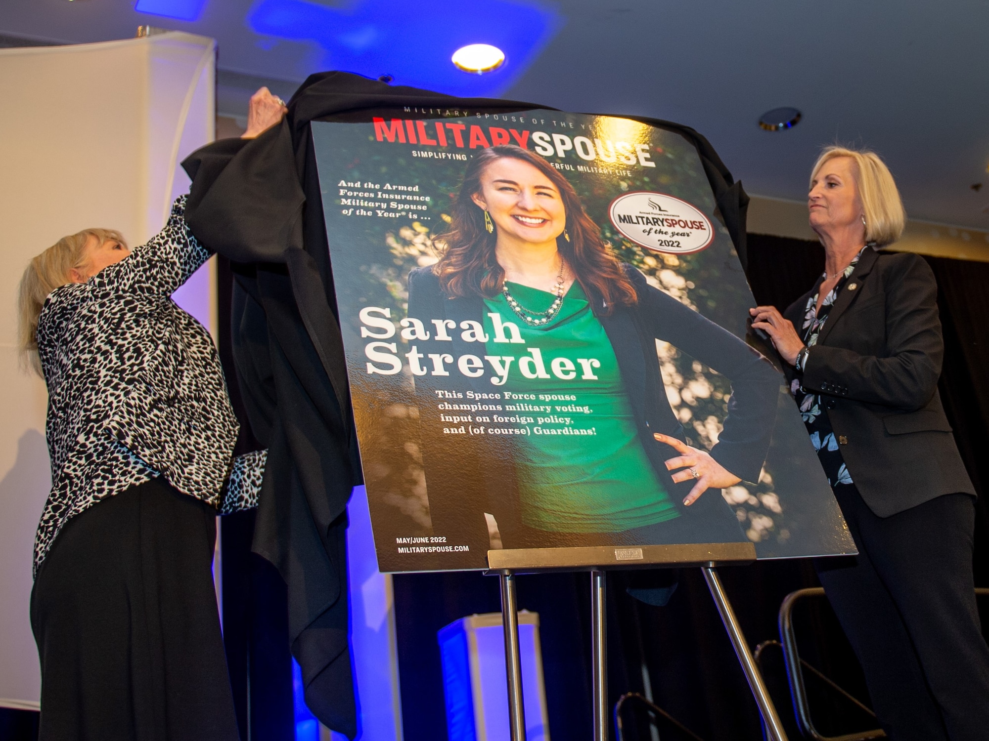 Sarah Streyder, the Armed Forces Insurance Space Force Spouse of the Year, is unveiled as also the Armed Forces Insurance Military Spouse of the Year during a ceremony in Arlington, Virginia, May 5, 2022. The award was founded in 2008 to recognize the contributions of military spouses. Streyder received the award for her advocacy and voting education efforts, after four rounds of advancement that began in January of this year. (U.S. Air Force photo by Tech. Sgt. Areca T. Wilson/Released)