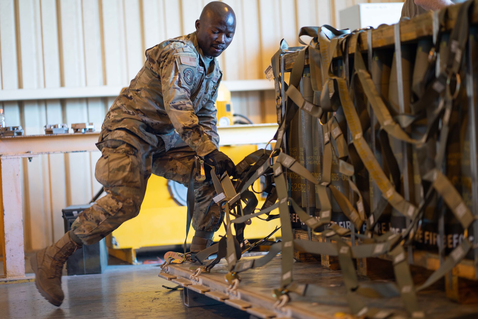 Photos of Airmen moving munitions for EUCOM.
