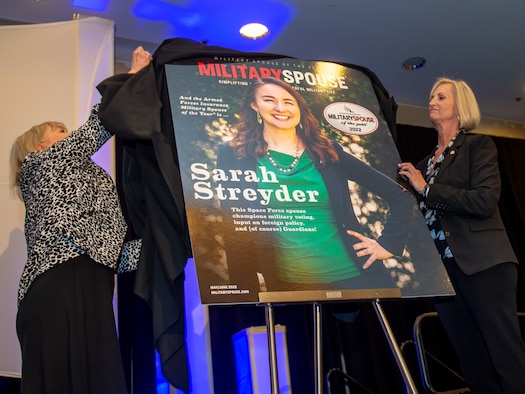 Sarah Streyder, the Armed Forces Insurance Space Force Spouse of the Year, is unveiled as also the Armed Forces Insurance Military Spouse of the Year during a ceremony in Arlington, Virginia, May 5, 2022. The award was founded in 2008 to recognize the contributions of military spouses. Streyder received the award for her advocacy and voting education efforts, after four rounds of advancement that began in January of this year. (U.S. Air Force photo by Tech. Sgt. Areca T. Wilson/Released)