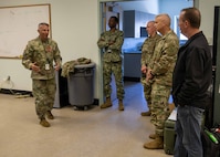 Maj. Gen. Jeff Van, left, Joint Task Force Civil Support commanding general, discusses how JTF-CS works together with various state, local, and federal agencies to respond to a catastrophic manmade or natural disaster with Commander, Contingency Command Post 1, Task Force 51, U.S. Army North, Maj. Gen. William Prendergast, second from right, and exercise observer/controllers during Exercise Vibrant Response 22, April 25, 2022.