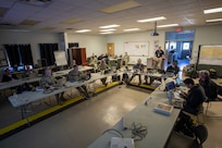 Joint Task Force Civil Support Forward Command Element and incident response team personnel attend a situation brief as part of the initial response during Exercise Vibrant Response 22, April 25, 2022.