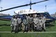 Members from the Civil Air Patrol pose for a photo with 1st Lt. Dontae Bell, 1st Helicopter Squadron pilot, (center) at Greene Stadium, Washington D.C., April 30, 2022. The 1st HS hosted the “We Fly, Too” event to promote diversity in aviation. (U.S. Air Force photo by Senior Airman Spencer Slocum)