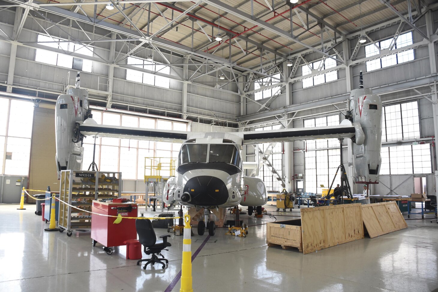 The VRM-30 CMV-22 Osprey inducted by FRCSW on Jan. 13 is pictured in Building 333. The inner composite skin of the aircraft suffered a 4-foot-by-2-foot crack during a mishap. FRCSW, FST, the V-22 program office and industry partners developed a repair plan to return the aircraft to its squadron.