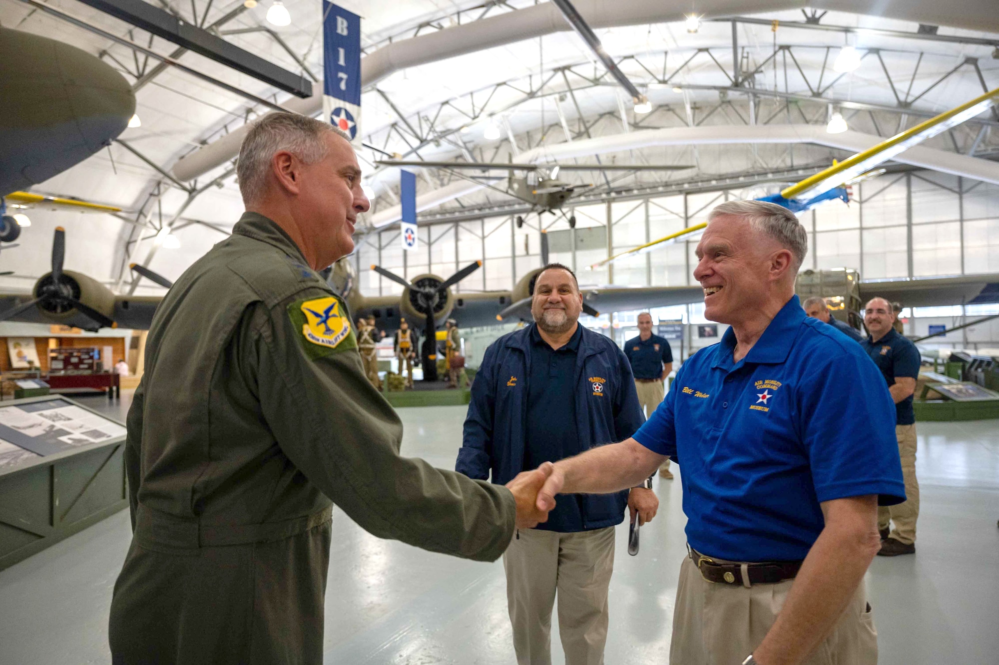 Gen. Mike Minihan, left, Air Mobility Command commander, greets an AMC Museum volunteer at Dover Air Force Base, Delaware, May 5, 2022. During his visit, Minihan and Chief Master Sgt. Brian Kruzelnick, AMC command chief, discussed daily operations and the future expansion projects at the museum. (U.S. Air Force photo by Senior Airman Faith Schaefer)