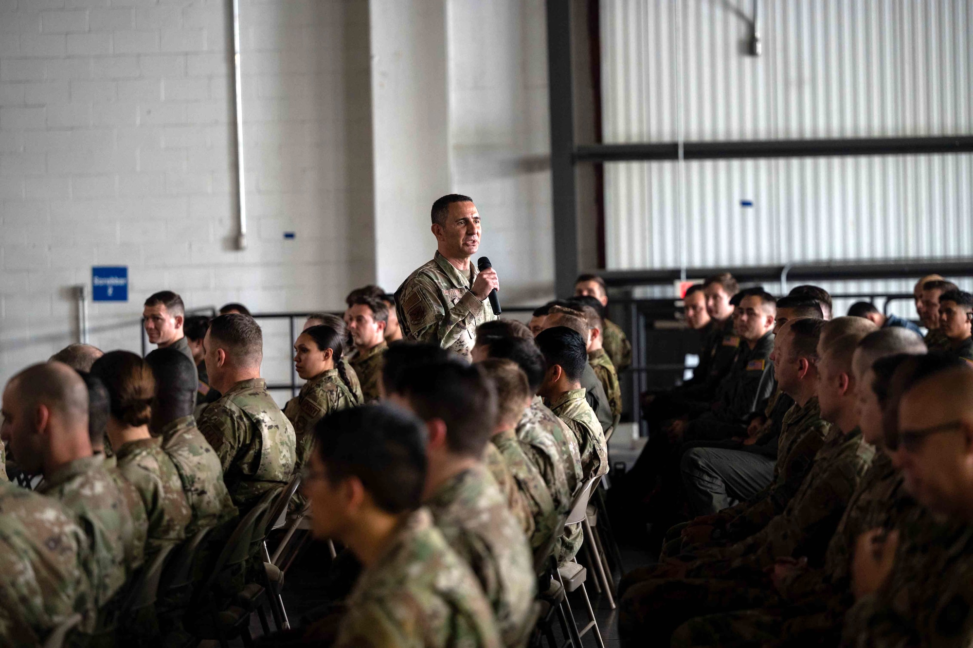 Chief Master Sgt. Brian Kruzelnick, Air Mobility Command command chief, speaks to Airmen during an all call at Dover Air Force Base, Delaware, May 5, 2022. During the all call, Kruzelnick discussed the state of the Air Force and how Dover AFB is innovating to accelerate change or lose. (U.S. Air Force photo by Senior Airman Faith Schaefer)