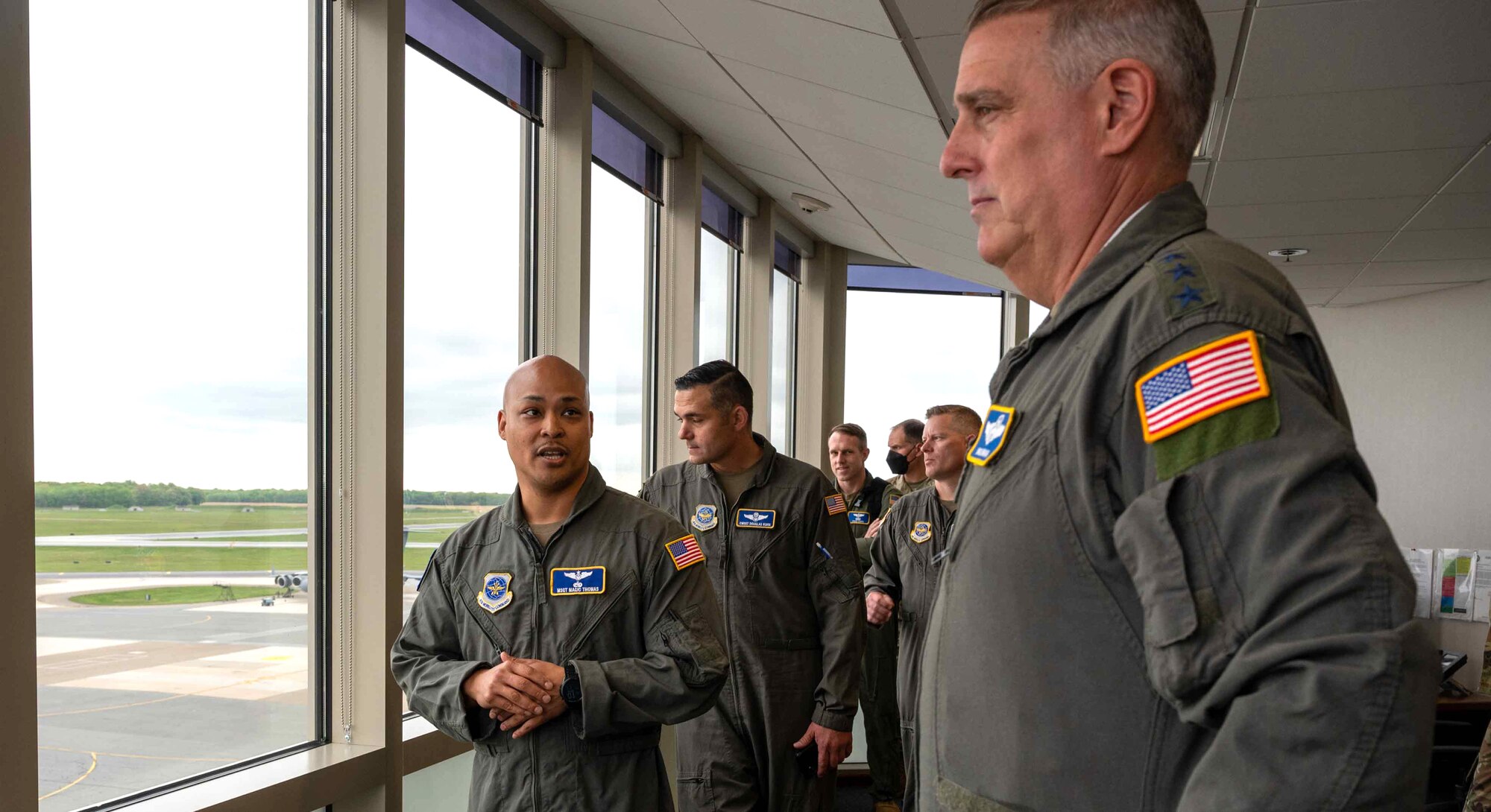 Master Sgt. Magic Thomas, left, 3rd Airlift Squadron loadmaster, briefs Gen. Mike Minihan, right, Air Mobility Command commander, on Agile Combat Employment plans for aircrew at Dover Air Force Base, Delaware, May 5, 2022. Airmen from the 3rd and 9th AS performed an ACE demo for the AMC leadership team. (U.S. Air Force photo by Senior Airman Faith Schaefer)