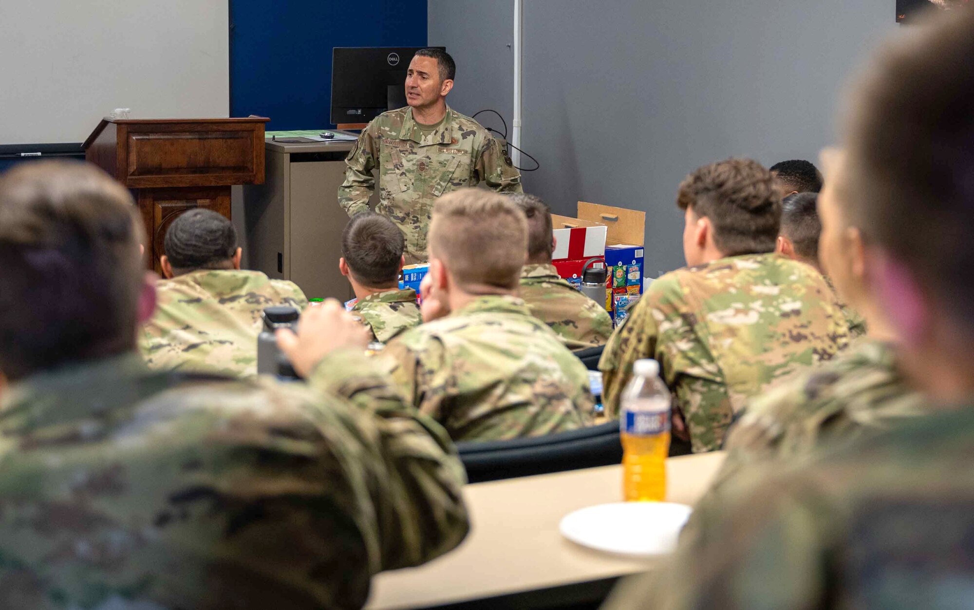 Chief Master Sgt. Brian Kruzelnick, Air Mobility Command command chief, speaks to Airmen at Airman Leadership School on Dover Air Force Base, Delaware, May 5, 2022. During the visit, Kruzelnick and Gen. Mike Minihan, AMC commander, highlighted top performing Airmen and toured base facilities such as the C-5 isochronal dock, the air traffic control tower and the Tactics and Leadership Nexus complex. (U.S. Air Force photo by Senior Airman Faith Schaefer)