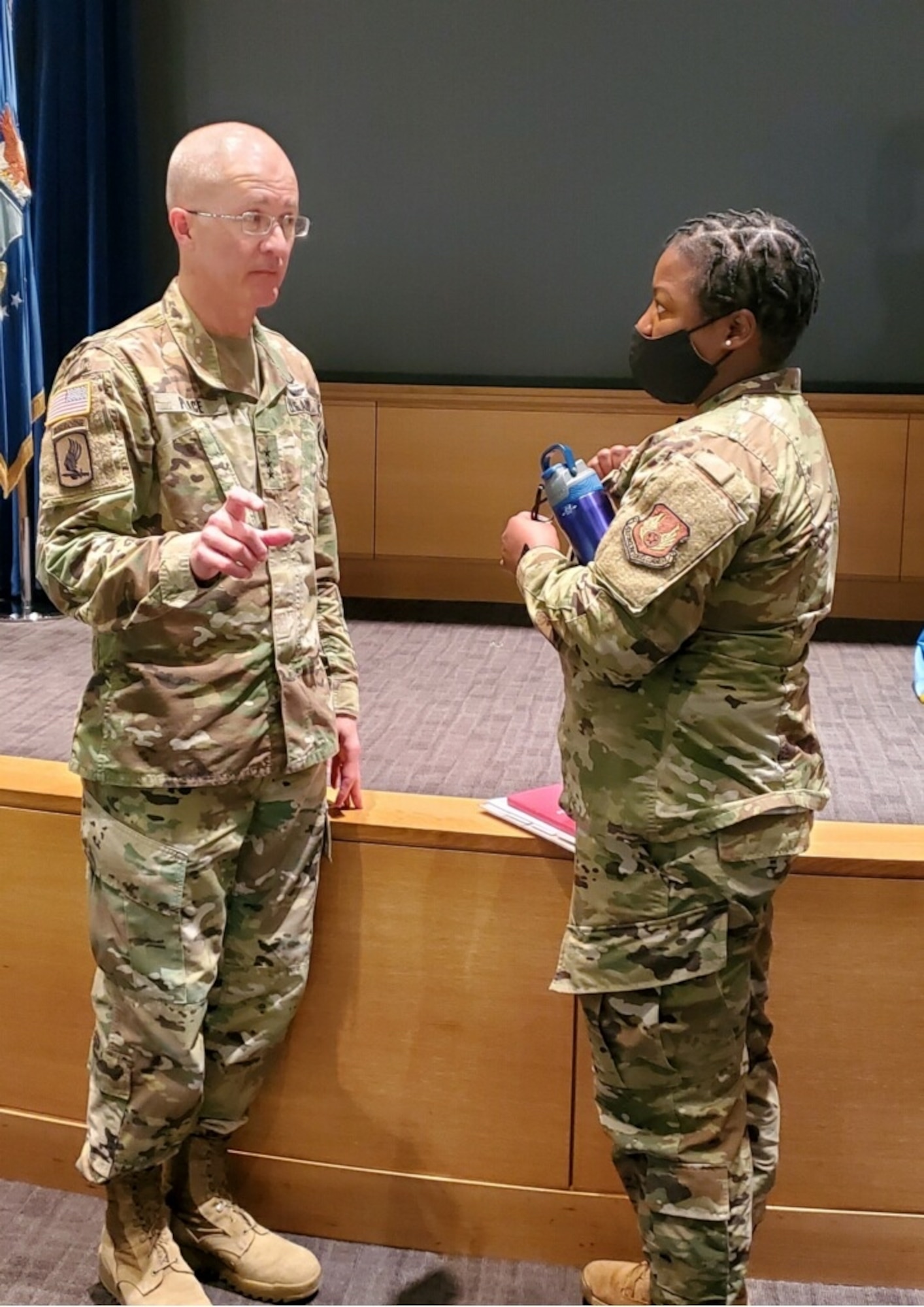 While visiting the Wright-Patterson Medical Center, Army Lt. Gen. Ronald Place addresses a question from Air Force Master Sgt. Portia Les'Pere at Wright-Patterson Air Force base, Ohio on April 12, 2022. Gragg visited the medical center to see its missions and capabilities firsthand. (U.S. Air Force photo by Kenneth Stiles)