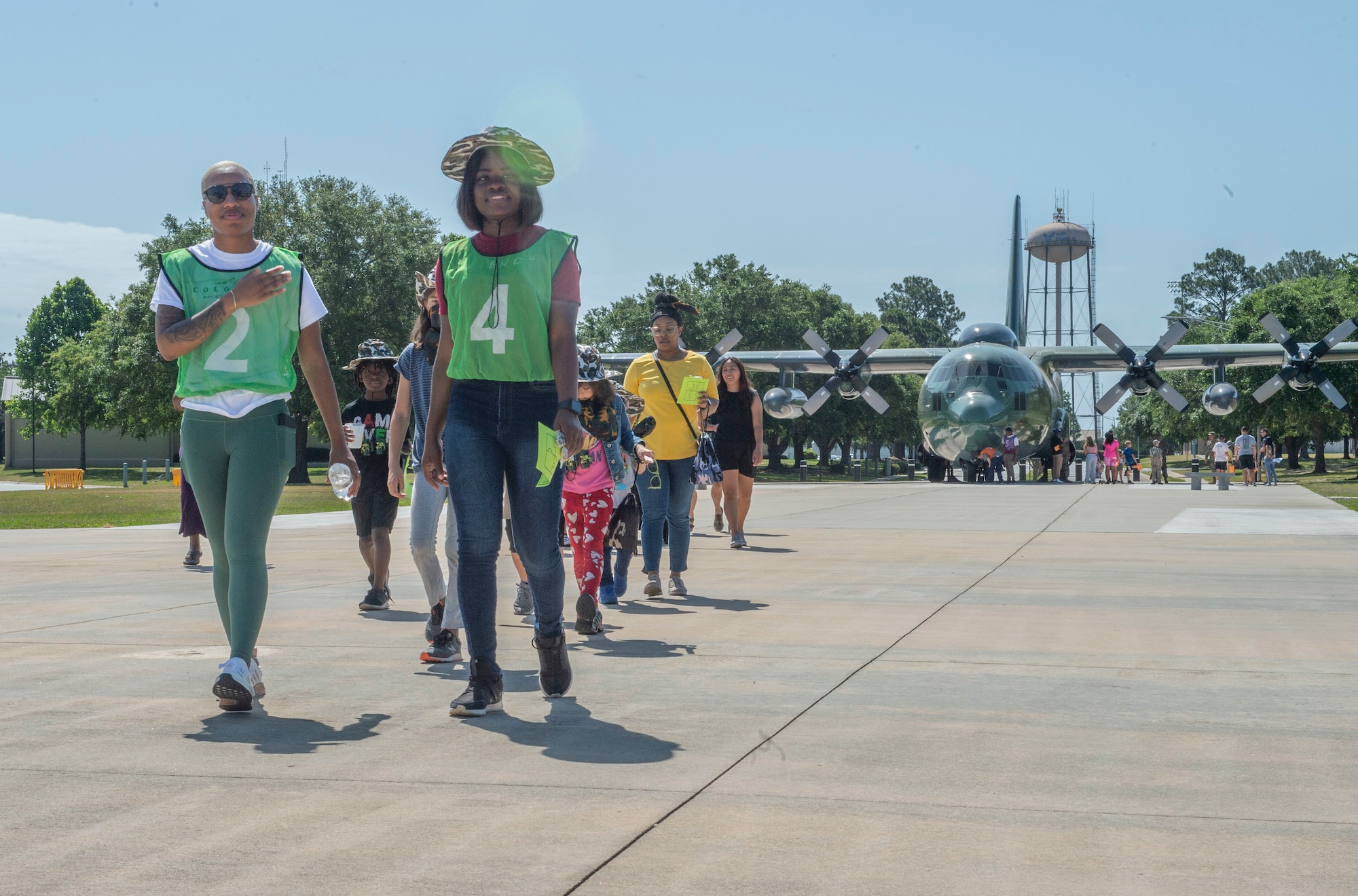 group of kids walking away from C-130