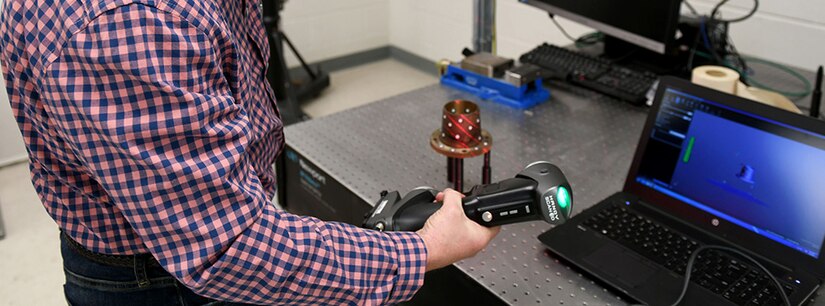 Man scanning device with a laser