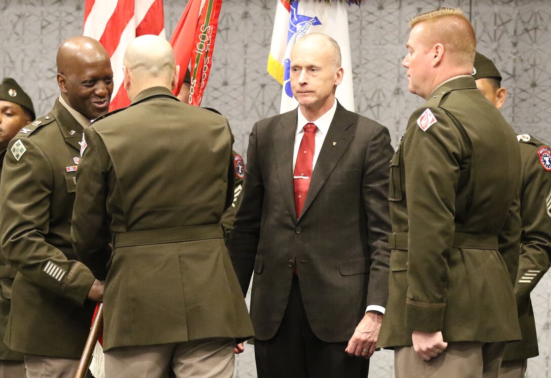 Col. Kenneth N. Reed receives the Southwestern Division colors from Lt. Gen. Scott A. Spellmon, Chief of Engineers and Commanding General of the U.S. Army Corps of Engineers during a change of command ceremony where Reed assumed command from Brig. Gen. Christopher G. Beck. Beck served as the commander since 2020. Beck will move to Fort Hood, Texas, to serve as the Deputy Commanding General, III Corps.