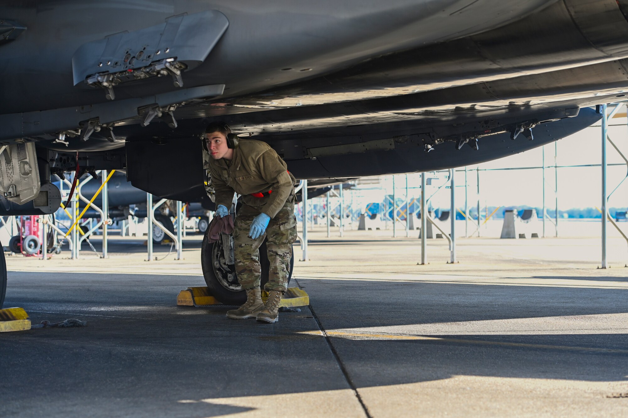 Prior to takeoff, maintainers’ remove pins and chocks. (U.S. Air Force photo by Senior Airman Kylie Barrow)